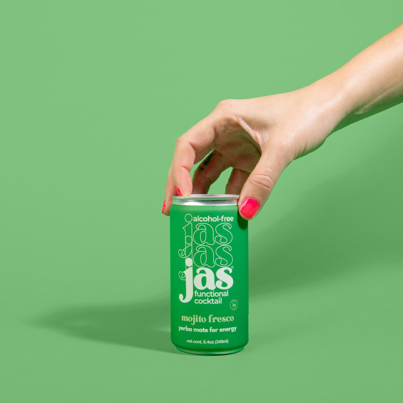 Woman holding JAS Mojito Fresco can