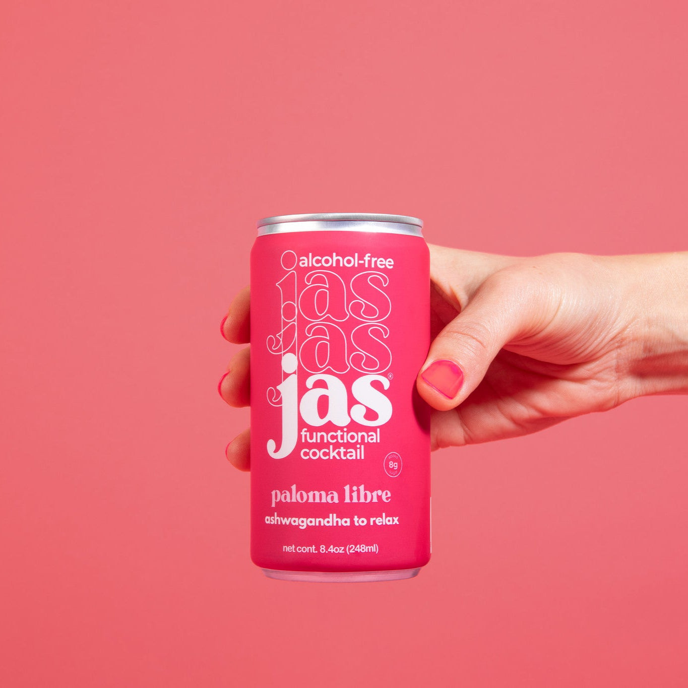 Model holding JAS Paloma Libre alcohol-free functional cocktail