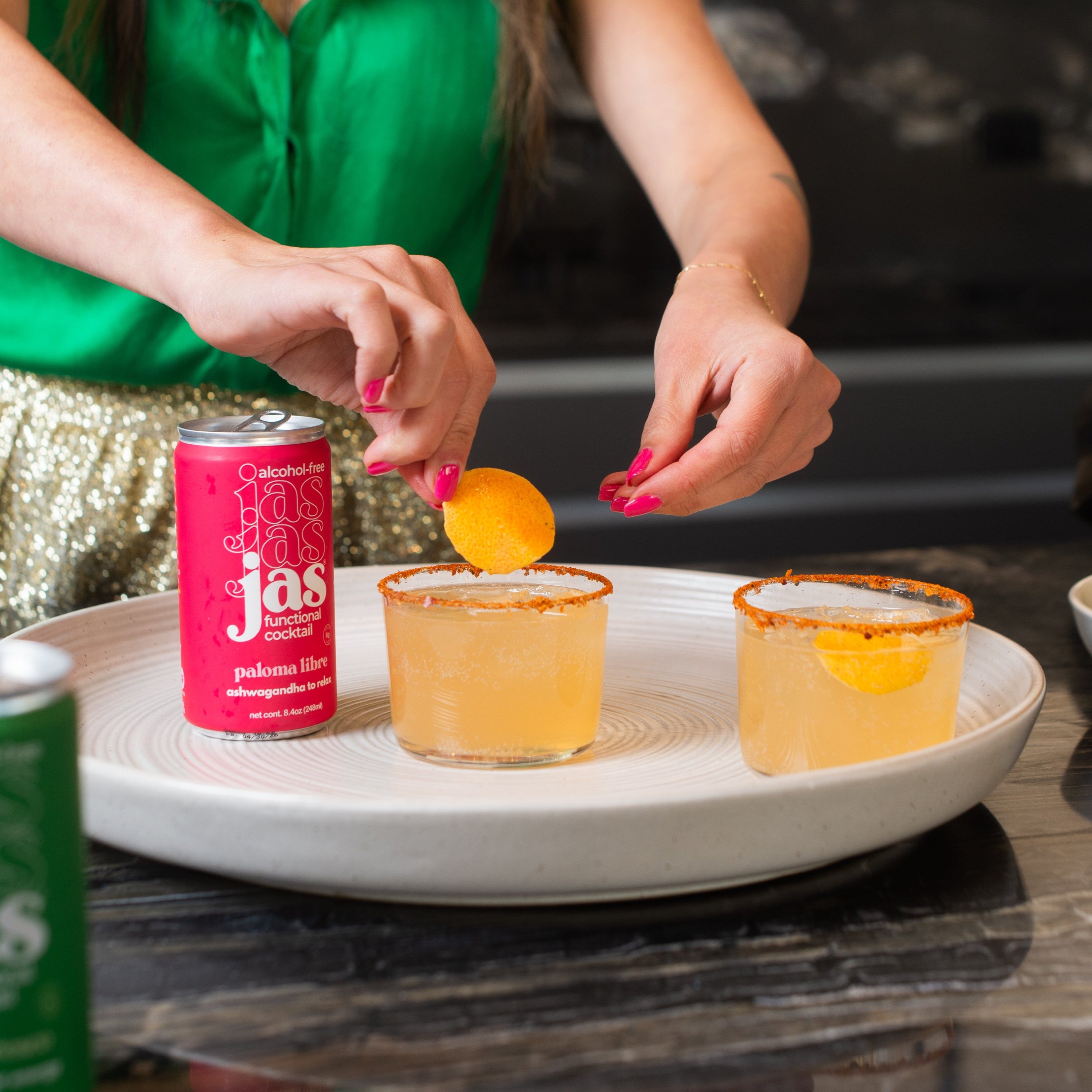 Garnishing a JAS Paloma Libre alcohol-free functional cocktail